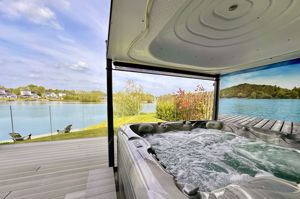 Hot tub with roof on ground floor deck- click for photo gallery